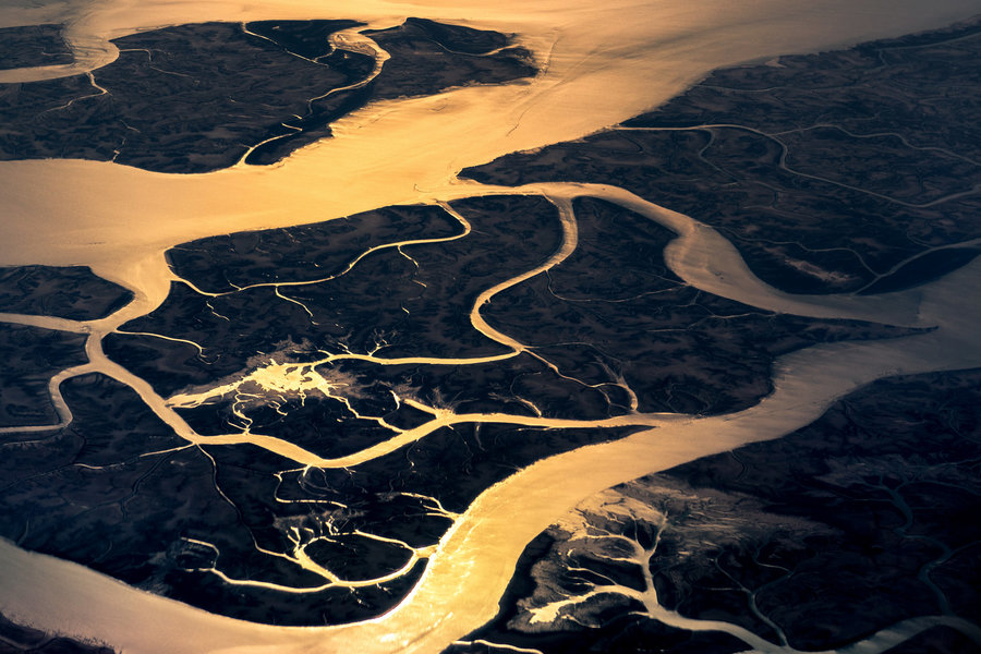 pakistan-sanctuary-rivers-water-reflection-islands-gold-sunlight-vanheijst.jpg